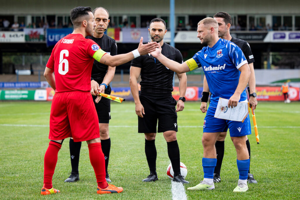 Kane Owen of Penybont shakes the hand of Daniel Toribio of Santa Coloma ahead of kick off.
Penybont v Santa Coloma in the UEFA Europa Conference League 1st Qualifying Round at The Brewery Field on the 13th July 2023