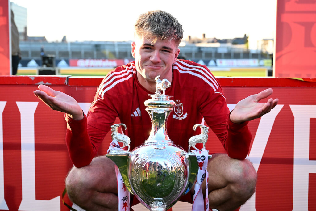 Connah's Quay Nomads Harry Franklin posing with the JD Welsh Cup