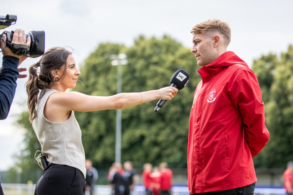Connah’s Quay Nomads’ Captain, John Disney is interviewed by S4C’s Sioned Dafydd ahead of Connah’s Quay Nomads vs NK Bravo in the UEFA Conference League First Qualifying Round Second Leg fixture at Nantporth Stadium, Bangor, Wales
