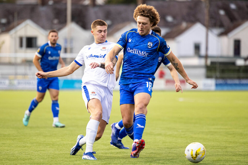 James Crole of Penybont in action against Greg Walters of Haverfordwest County.
Haverfordwest County v Penybont in the JD Cymru Premier at Richmond Park on the 22nd August 2024.