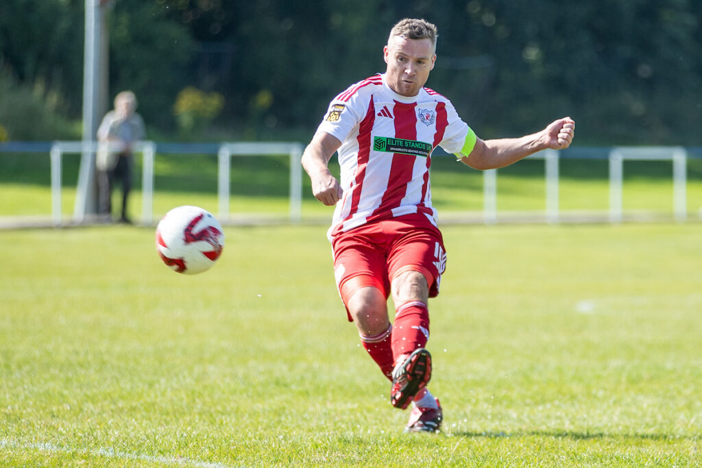 Danny Andrews in action for Holywell Town in the JD Cymru North. 