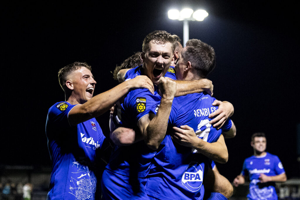 Nathan Wood of Penybont celebrates scoring his sides second goal scored by Chris Venables. Penybont v The New Saints in the JD Cymru Premier at the SDM Glass Stadium on the 20th September 2024