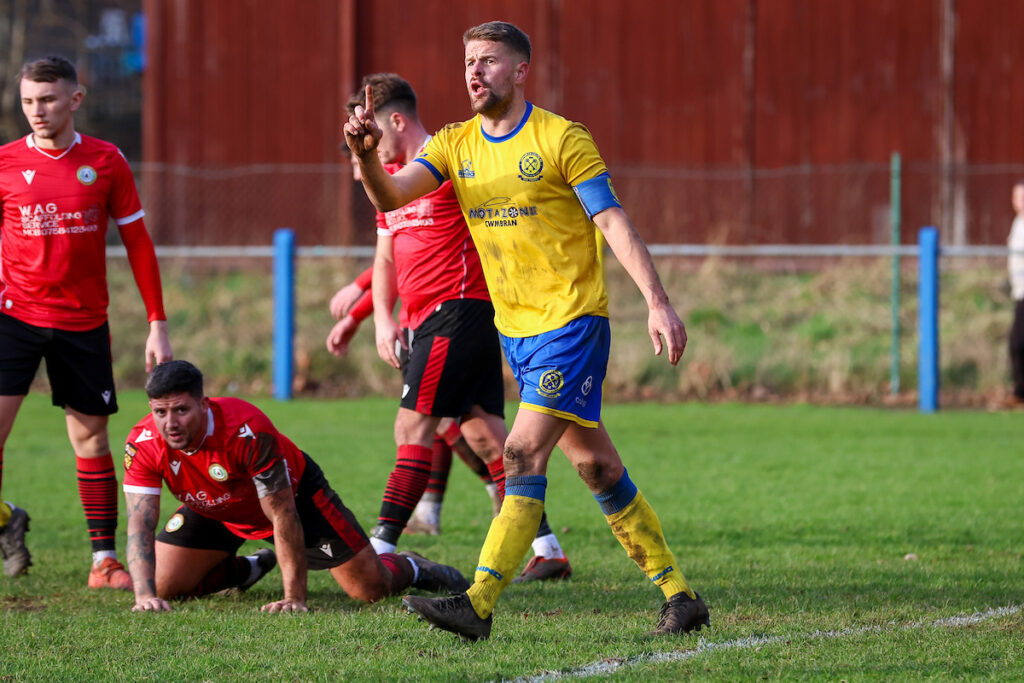Flint's Ryan Kershaw shoots during Flint Mountain FC vs Denbigh Town FC in Round 7 of the JD Cymru North at the Essity Stadium, Flint