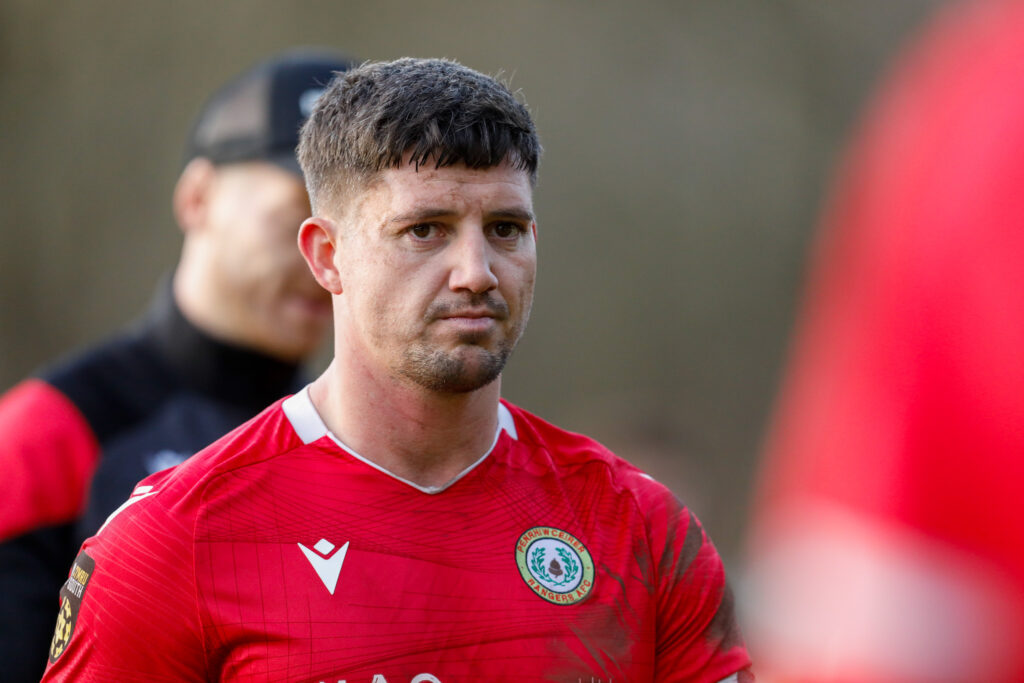 Warren Jones of Penrhiwceiber Rangers at full time after the 2024/25 JD Cymru South fixture between Cwmbran Celtic FC and Penrhiwceiber Rangers AFC at Avondale Motorpark Arena, Cwmbran, Wales