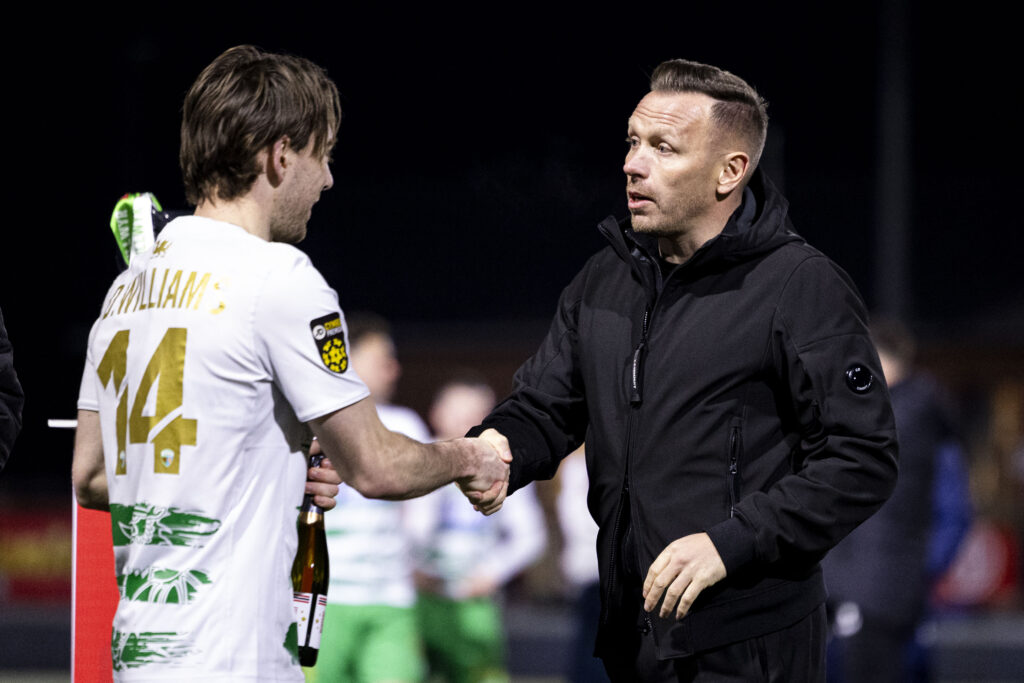 Craig Bellamy with Dan Williams of TNS during the 2024/25 Nathaniel MG Cup Final fixture between Aberystwyth Town FC & The New Saints FC at Latham Park, Newtown, Wales