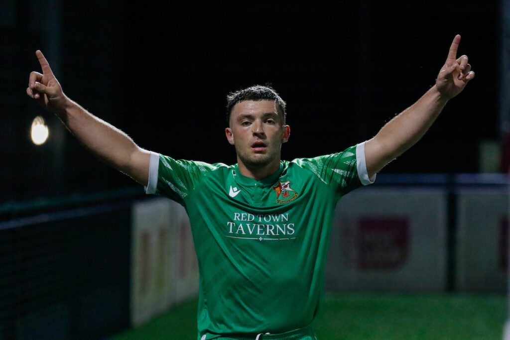 Liam Eason of Llanelli Town AFC celebrates after the games during the 2024/25 JD Cymru South league fixture between Pontypridd United and Llanelli Town at USW Sports Park, Pontypridd, Wales
