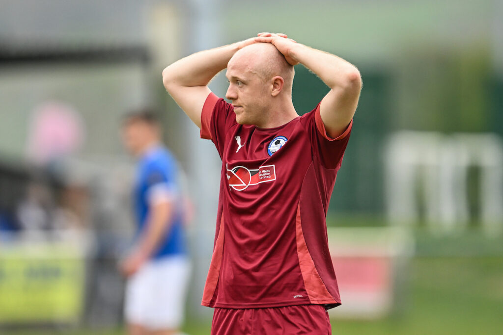 Airbus UK Broughton player Danny Warren is dejected at the end of the 2024/25 JD Cymru North fixture Caersws v Airbus UK Broughton FC at Caersws Recreation Ground, Caersws , Wales