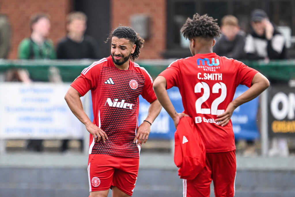 Wahib Tahra of Newtown AFC is dejected as his side is relegated after losing the 2024/25 JD Cymru Premier fixture between Newtown AFC & Aberystwyth Town at Latham Park, Newtown, Wales