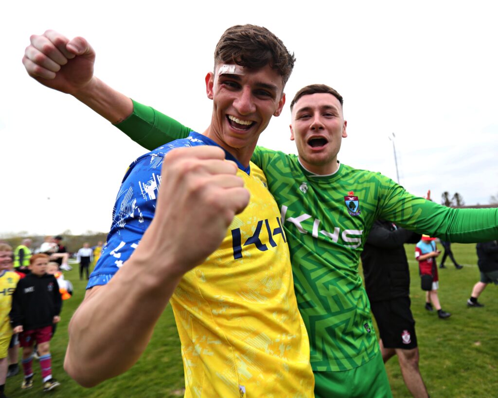 Sol Forde and Rhys Williams of Colwyn Bay celebrate winning the JD Cymru North after CPD Penrhyncoch vs Colwyn Bay FC in Round 30 of the JD Cymru North at Cae Baker, Penrhyncoch