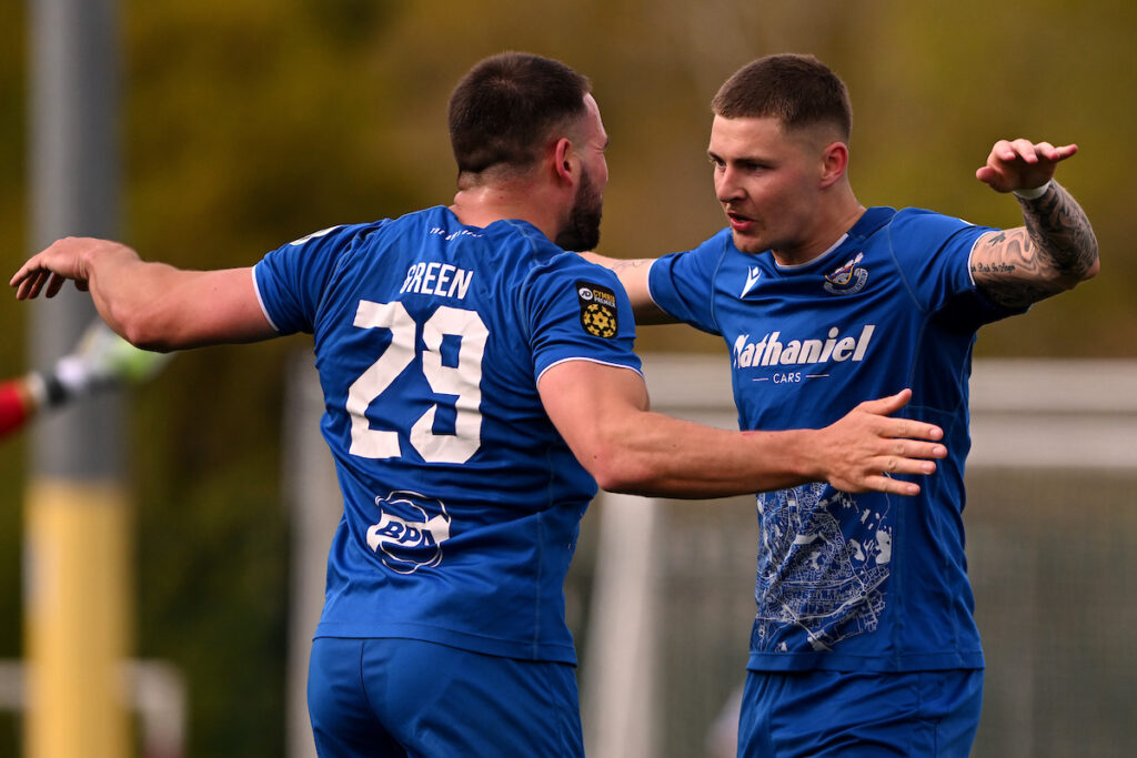 Penybont's James Crole celebrates scoring his sides third goal during the JD Cymru Premier 24/25 Championship Conference match between Penybont FC and Caernarfon Town FC at SDM Glass Stadium in Bridgend on the 13th April 2025