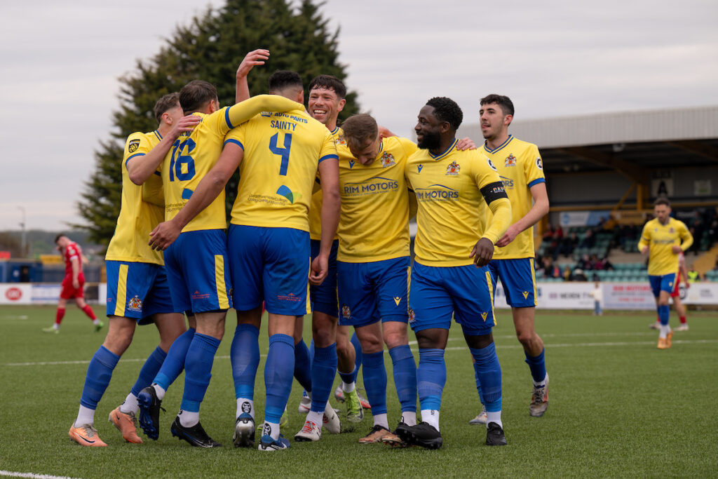 Barry Town's Callum Sainty celebrates scoring his sides first goal during the JD Cymru Premier 24/25 Play Off Conference match between Barry Town United and Briton Ferry Llansawel FC at Jenner Park Stadium in Barry on the 19th April 2025