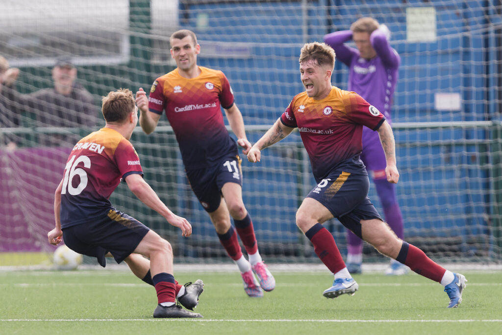 Cardiff Met's Ryan Reynolds scores and celebrates 1-0 during the 2024/25 JD Cymru Premier League European Play-Off fixture Between Cardiff Metropolitan University F.C & Bala Town F.C at Cardiff Met Cyncoed Campus, Cardiff, Wales