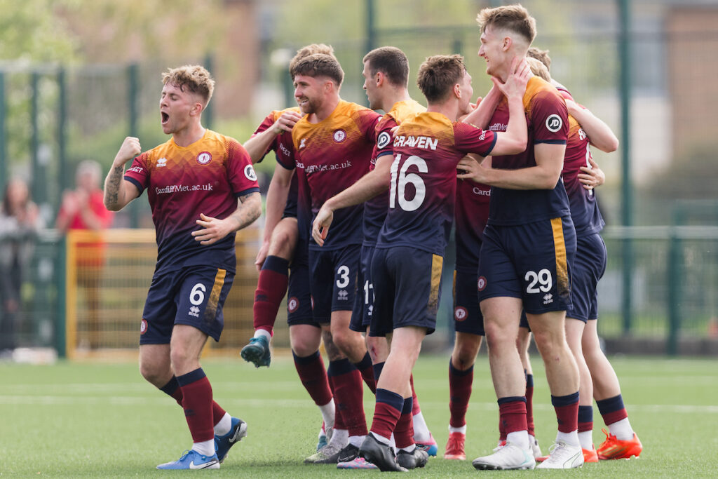 Cardiff Met's Ryan Reynolds scores and celebrates 1-0 during the 2024/25 JD Cymru Premier League European Play-Off fixture Between Cardiff Metropolitan University F.C & Bala Town F.C at Cardiff Met Cyncoed Campus, Cardiff, Wales