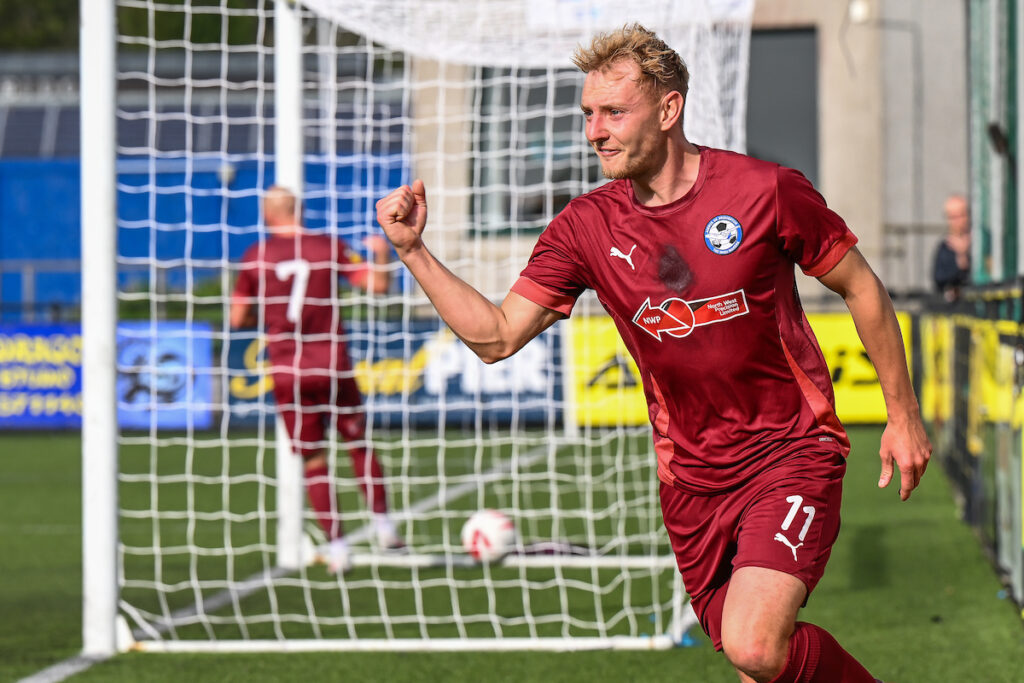 George Peers of Airbus UK Broughton celebrates his goal to make it 0-1 during the 2024/25 Welsh Blood Service League Cup Final fixture between Trefelin BGC v Airbus UK Broughton FC at Park Avenue, Aberystwyth, Wales