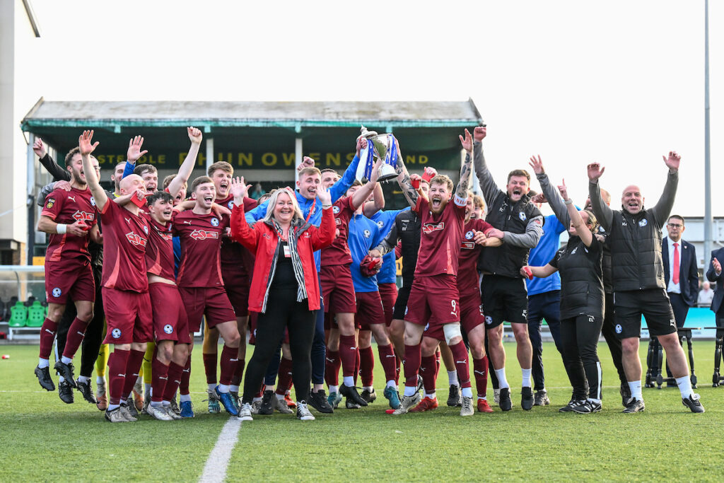 Airbus UK Broughton lift the Welsh Blood Service League Cup trophy.