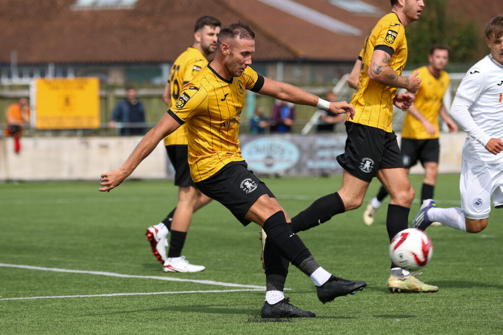 Luke Cummings in action for Carmarthen Town in the Nathaniel MG Cup