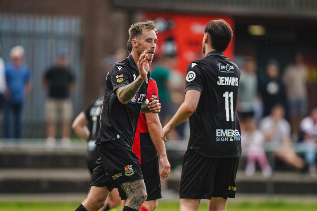 Alex Bonthron celebrates scoring for JD Cymru Premier side Llanelli Town in the Nathaniel MG Cup