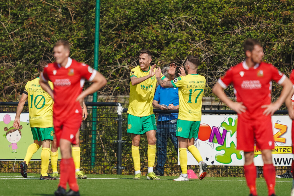 Caernarfon Town players celebrating a goal during the JD Cymru Premier 2025/26 fixture Caernarfon Town vs Llanelli Town at Go Goodwins Stadium, Llandudno, Wales