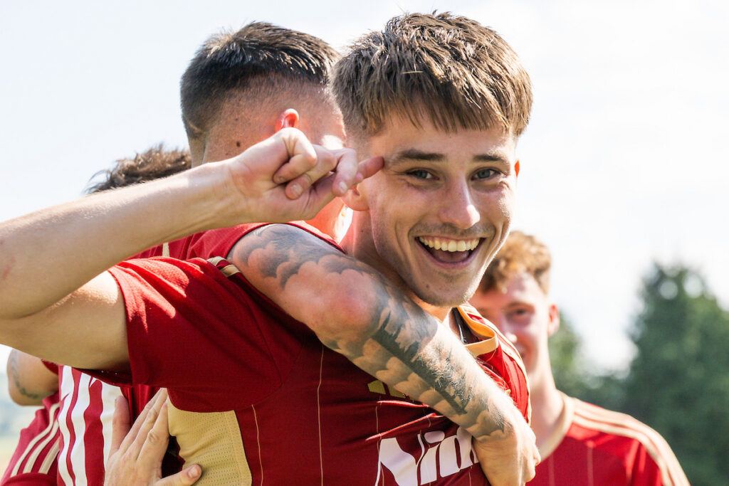 Jamie Hyne of Newtown celebrates his goal to make it 1-0 during the JD Cymru North game between Newtown and Caersws at Latham Park in Newtown on the 25th August 2025