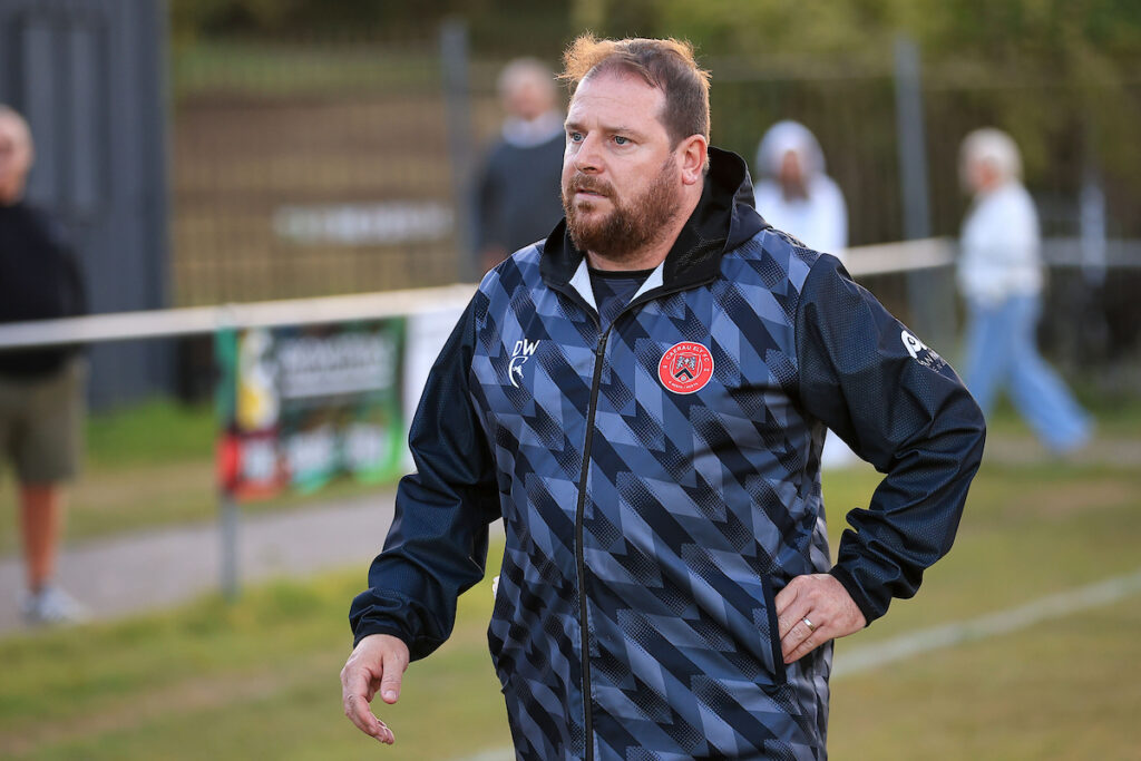 Caerau Ely FC Manager Dean Wheeler during the 2025/26 Welsh Blood Service League Cup  fixture between Caerau Ely FC & Treowen Stars AFC at Cwrt yr Ala Road, Cardiff, Wales