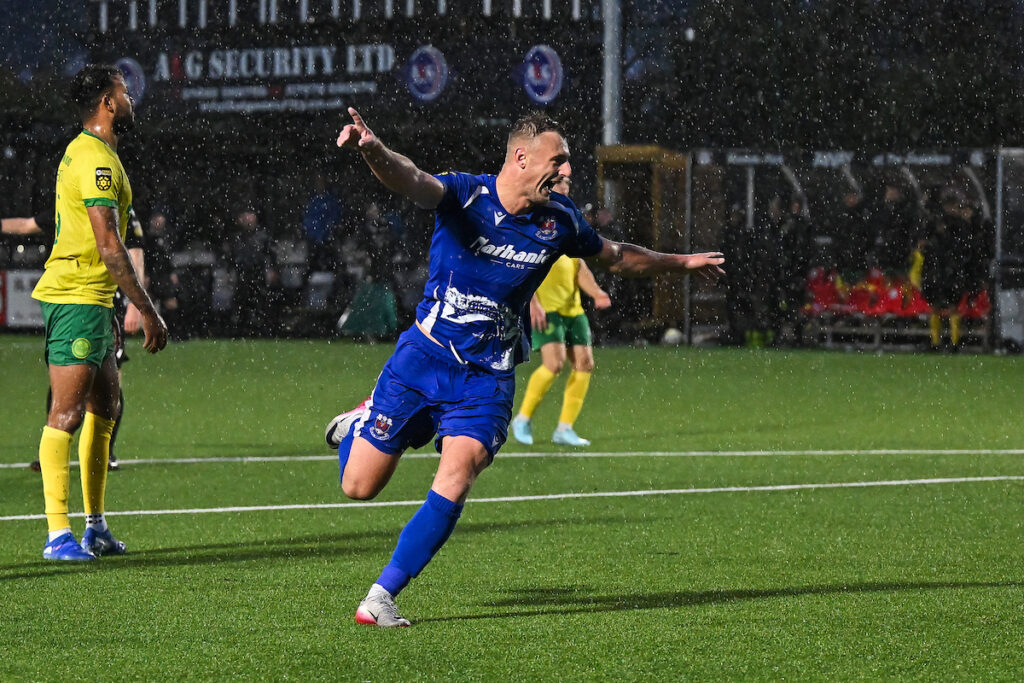 Noah Daley of Penybont celebrates his goal to make it 0-1 during the JD Cymru Premier between Caernarfon Town and Penybont at the Go Goodwins Stadium in Llandudno on the 20th September 2025