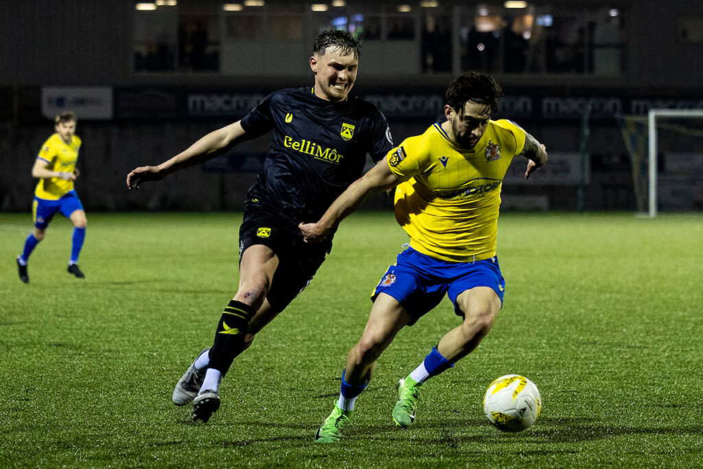 Ollie Hulbert of Barry Town United in action against Alaric Jones of Haverfordwest County.
Barry Town United v Haverfordwest County in the JD Cymru Premier at Jenner Park on the 14th January 2025