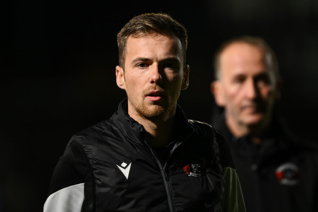 Jordan Hadaway, Manager of Llandudno heads to the dressing room at half time during the JD Cymru North between Llandudno and Airbus UK Broughton at the Go Goodwins Stadium in Llandudno
