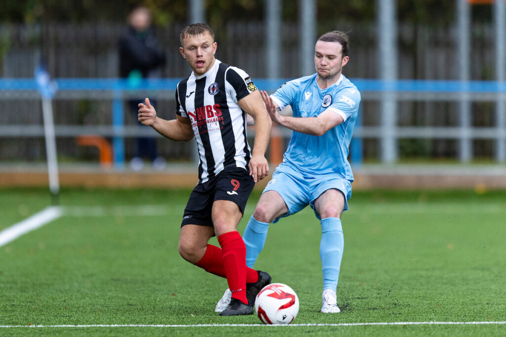 Sam Roberts of Cardiff Draconians in action against Taylor Jones of Cambrian United.
Cambrian United v Cardiff Draconians in the JD Cymru South at the M&P Group 3G on the 1st November 2025.