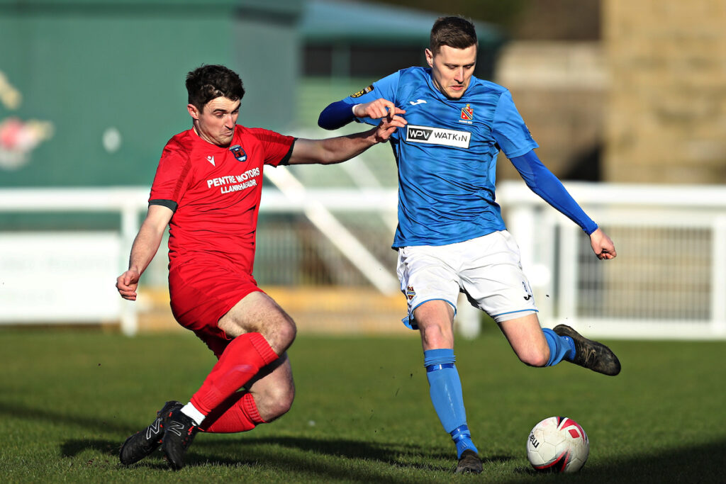 Ryan Davies of Ruthin pressures Dan Cox of Bangor during CPD Bangor 1876 vs Ruthin Town in Round 2 of the Welsh Blood Service League Cup Northern Section at Nantporth Stadium, Bangor