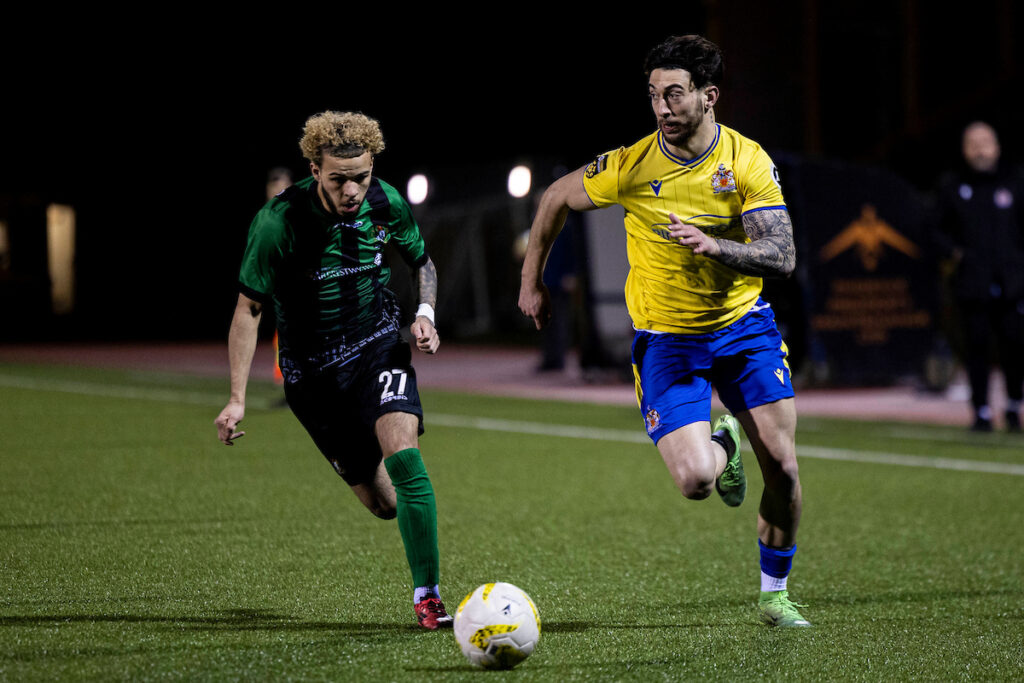Ollie Hulbert (R) in action for Barry Town United against Aberystwyth Town