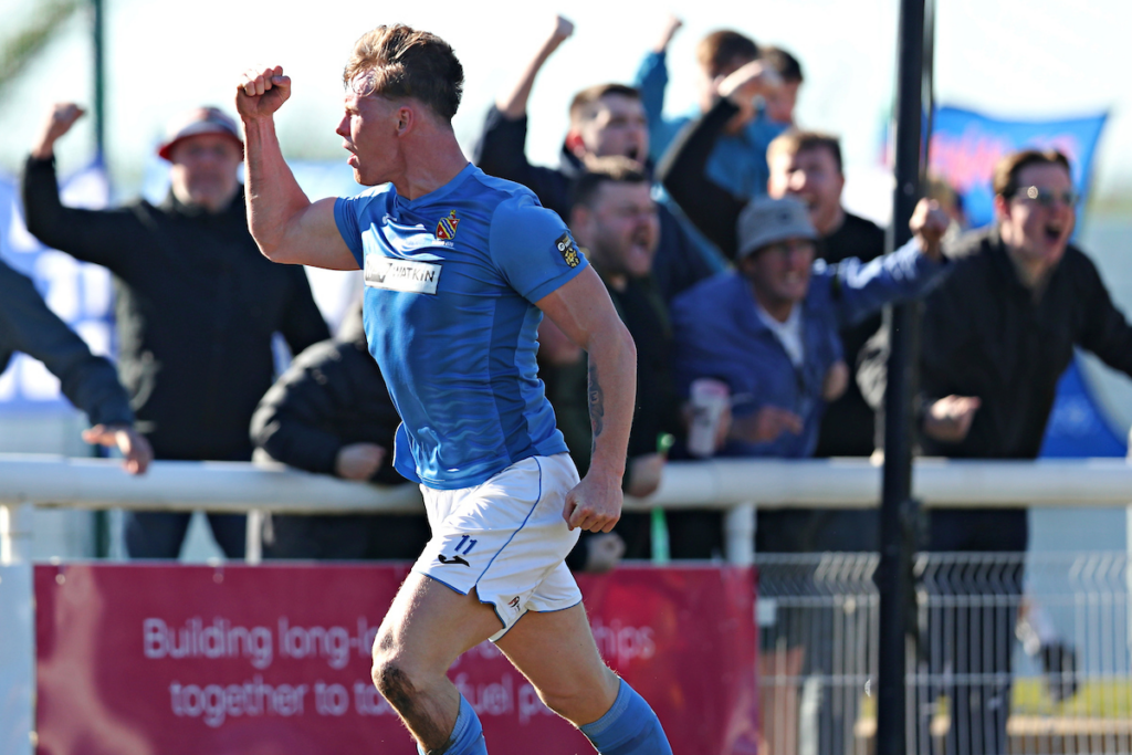 Dylan Summers-Jones of Bangor 1876 celebrates his goal during CPD Bangor 1876 vs CPD Penrhyncoch in Round 3 of the Welsh Blood Service League Cup at Nantporth Stadium, Bangor