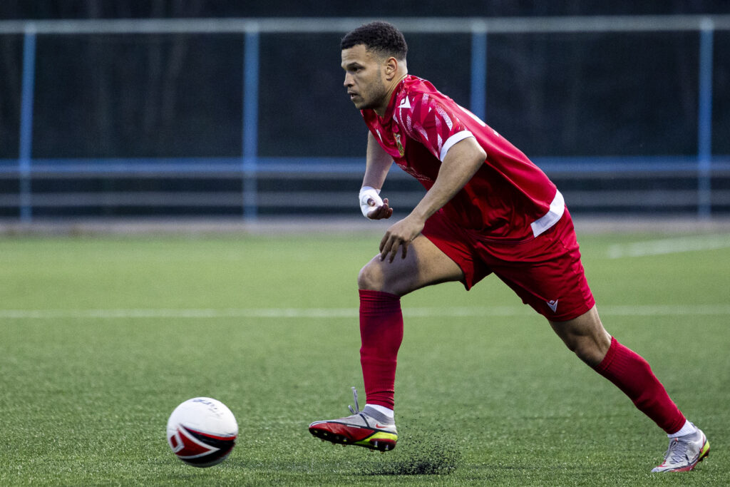 Theo Wharton of Llanelli Town and Saint Kitts and Nevis in action.
Cambrian United v Llanelli Town in the JD Cymru South at the M&P Group 3G on the 4th April 2025