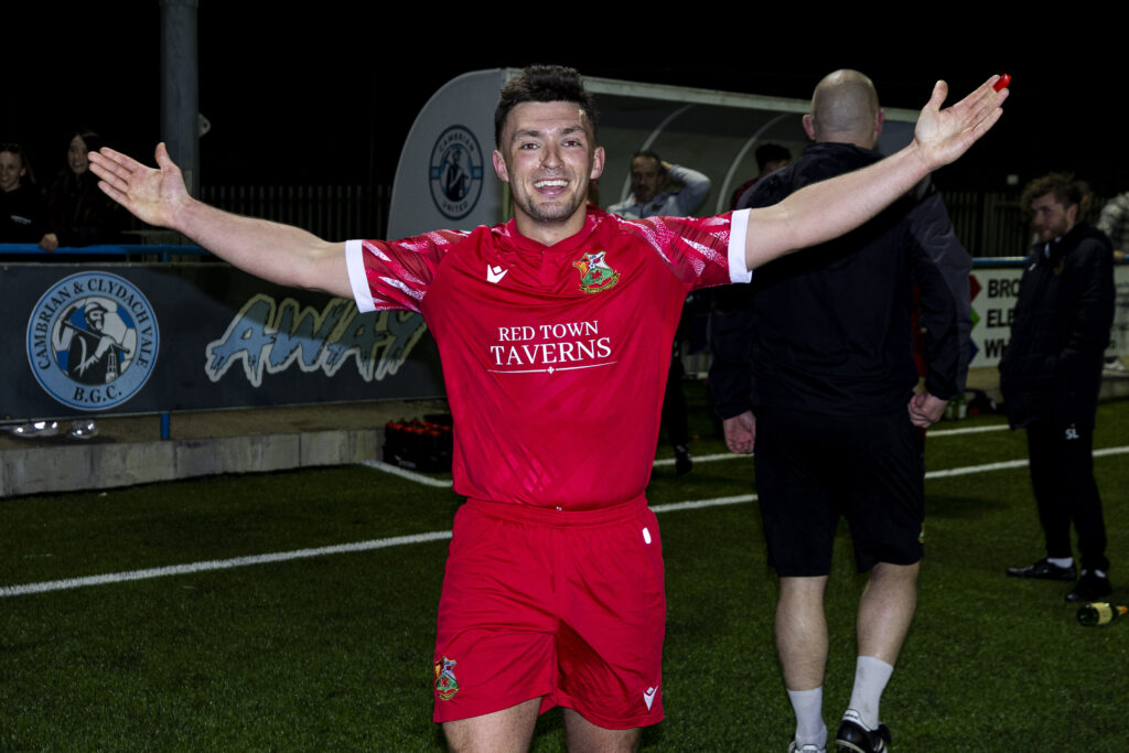 Liam Eason of Llanelli Town celebrates at full time. Cambrian United v Llanelli Town in the JD Cymru South at the M&P Group 3G on the 4th April 2025