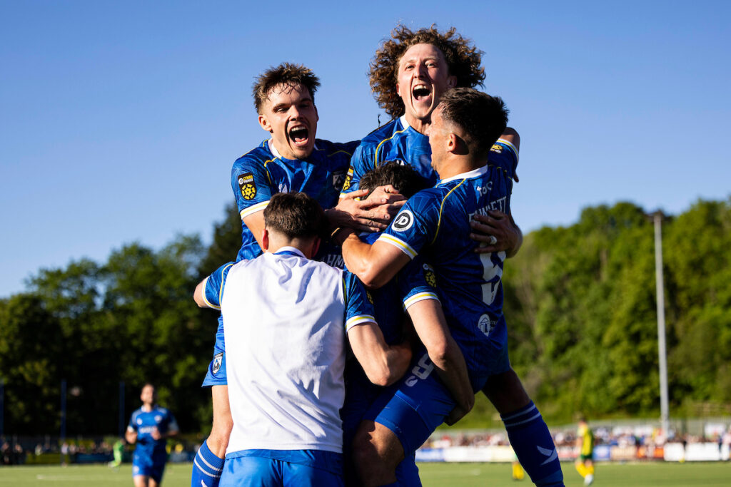 Haverfordwest County's Ben Ahmun celebrates scoring his sides third goal during the JD Cymru Premier 24/25 - European Play Off match between Haverfordwest County AFC and Caernarfon Town at Ogi Bridge Meadow Stadium in Haverfordwest on the 18th May 2025