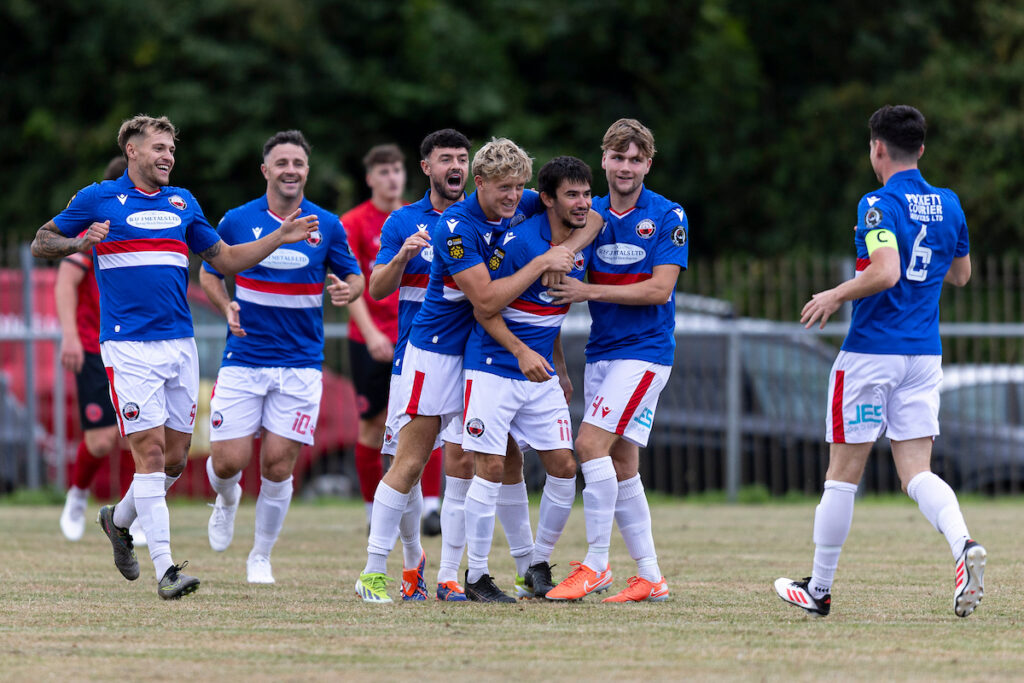 Kostya Georgievsky celebrates after scoring for Trefelin BGC against Caerau Ely in the Nathaniel MG Cup
