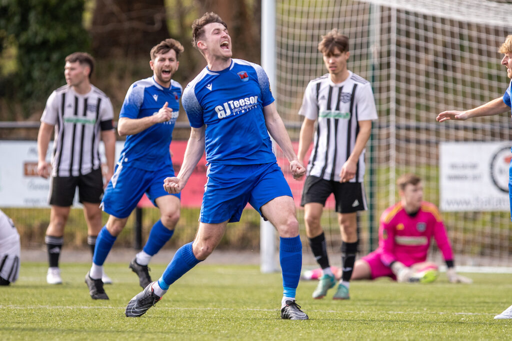 Ruthin Town's Sam Jones opens the scoring during the JD Cymru North fixture between Ruthin Town and Llay Welfare at Maes Tepid, Bala. 8th of March, Bala, Wales