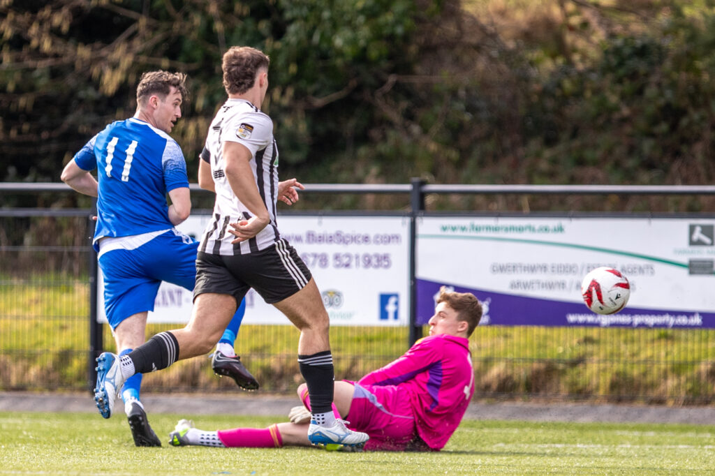 Ruthin Town's Sam Jones scores his second to make it 2-0 during the JD Cymru North fixture between Ruthin Town and Llay Welfare at Maes Tepid, Bala