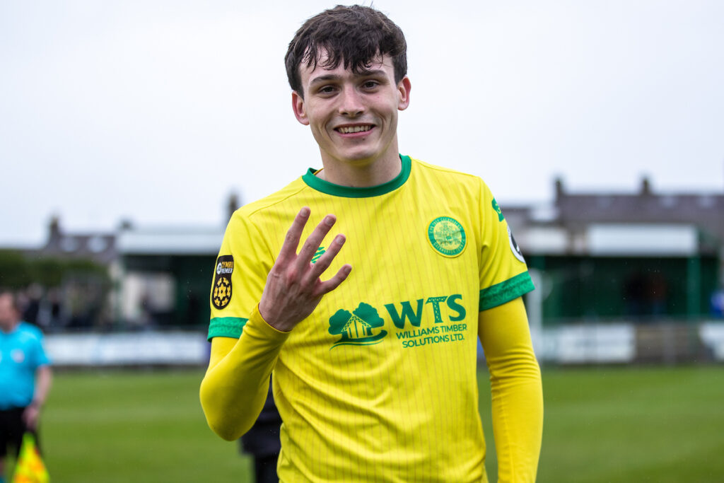 Caernarfon Town's Louis Lloyd celebrates his four goals at full time following the JD Cymru Premier Playoff fixture between Caernarfon Town and Barry Town United at the Carling Oval, Caernarfon, Wales
