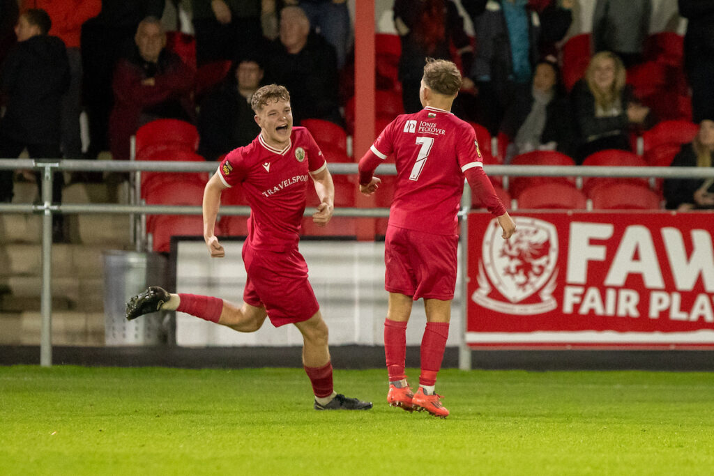Denbigh Town's Nathan Brown scores a late goal during the JD Cymru North fixture between Denbigh Town and Ruthin Town at Central Park, Denbigh. 24th of October, Flint, Wales