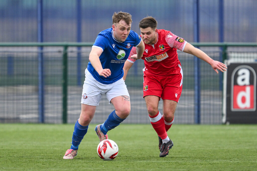 Max McLaughlin of Caersws makes a break with the ball during the 2024/25 JD Cymru North fixture between Gresford Athletic and Caersws at The Hollingsworth Group Stadium, Broughton, Wales