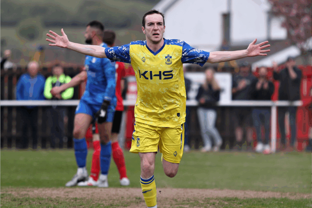 Dan Atkins celebrates scoring a goal for Colwyn Bay in the JD Cymru North