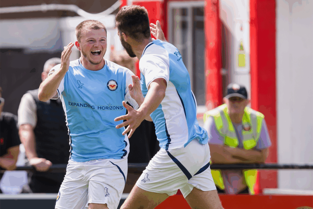 Josh Graham celebrates scoring for Newport City against Trefelin BGC in the Cymru South