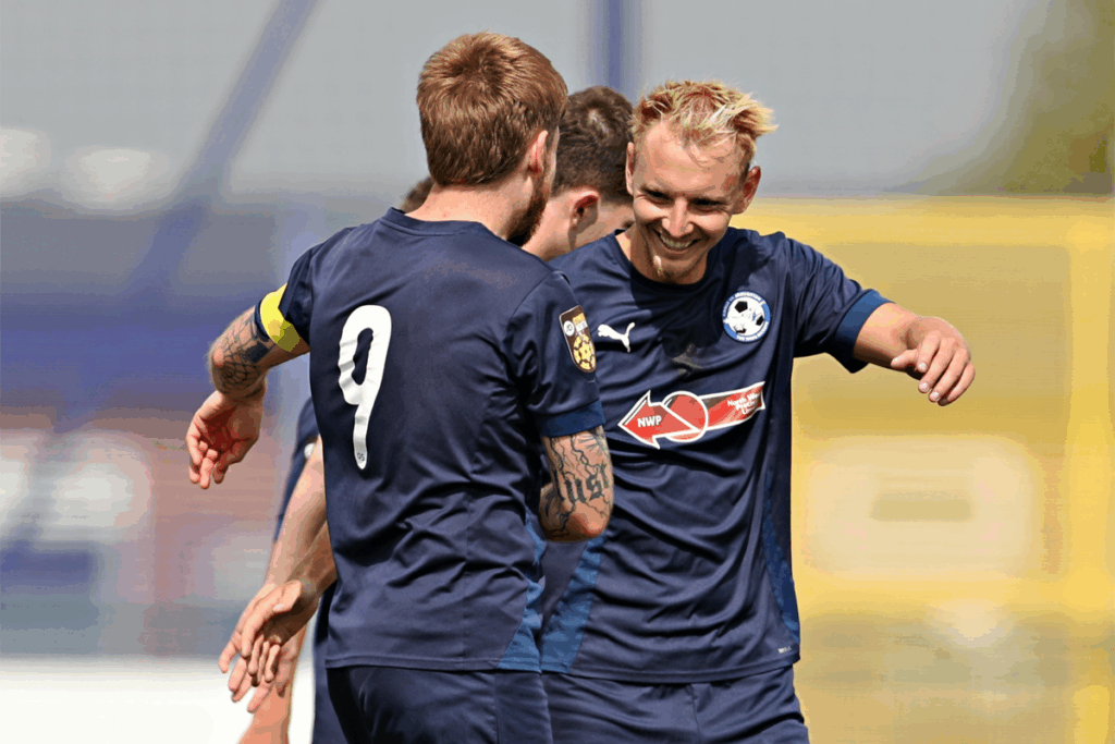 George Peers celebrates scoring for Airbus UK in the JD Cymru North
